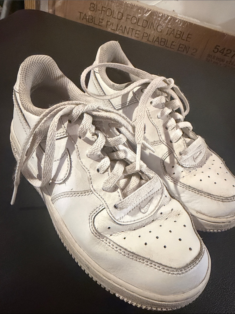 Kids white Nike sneakers